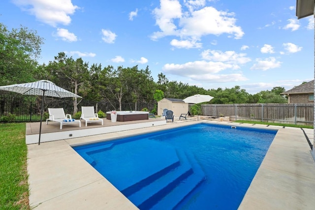 2420 Soprano Way, Round Rock, TX 78681 - view of swimming pool featuring a fenced backyard, a patio, a hot tub, and a shed