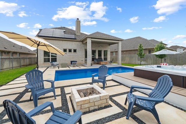 2420 Soprano Way, Round Rock, TX 78681 - view of pool with an outdoor hot tub, a patio, a fire pit, and a fenced backyard
