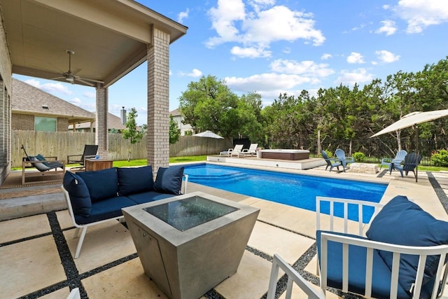 2420 Soprano Way, Round Rock, TX 78681 - view of swimming pool with a hot tub, an outdoor living space with a fire pit, ceiling fan, a fenced backyard, and a patio