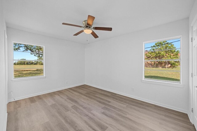 2111 Mardean Ln, Temple, TX 76501 - spare room with ceiling fan, a wealth of natural light, and light wood-style flooring