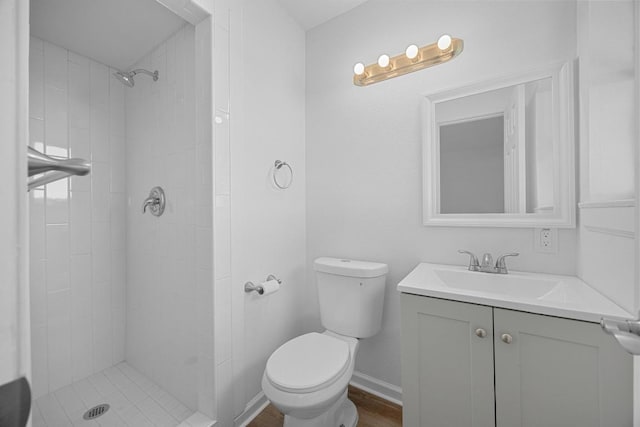 2111 Mardean Ln, Temple, TX 76501 - bathroom with a tile shower, toilet, and vanity
