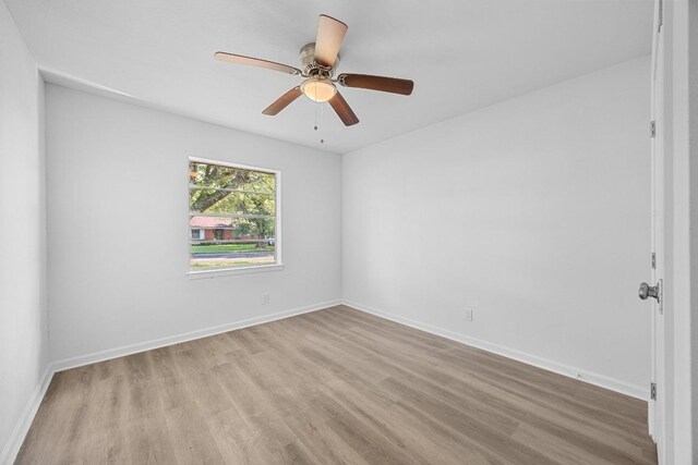 2111 Mardean Ln, Temple, TX 76501 - unfurnished room featuring a ceiling fan, wood finished floors, and baseboards