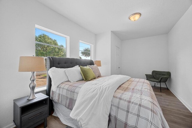 2111 Mardean Ln, Temple, TX 76501 - bedroom with baseboards and wood finished floors