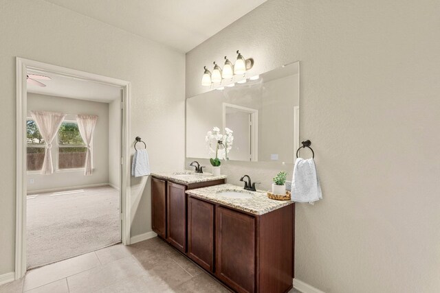 full bathroom featuring tile patterned floors, vanity, and baseboards