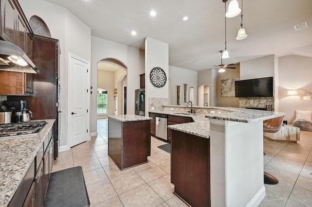 605 River Oaks Dr, Austin, TX 78748 - kitchen featuring a sink, stainless steel appliances, visible vents, arched walkways, and light tile patterned floors