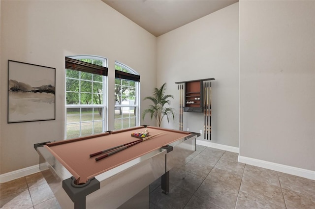 game room featuring baseboards, high vaulted ceiling, tile patterned floors, and billiards