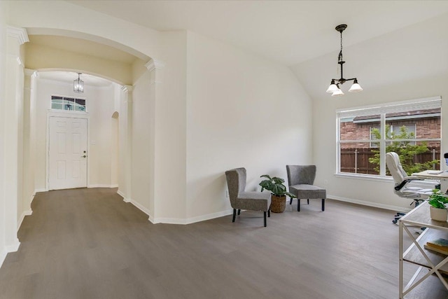 11805 Larch Valley Dr, Austin, TX 78754 - living area with arched walkways, wood finished floors, vaulted ceiling, and a chandelier