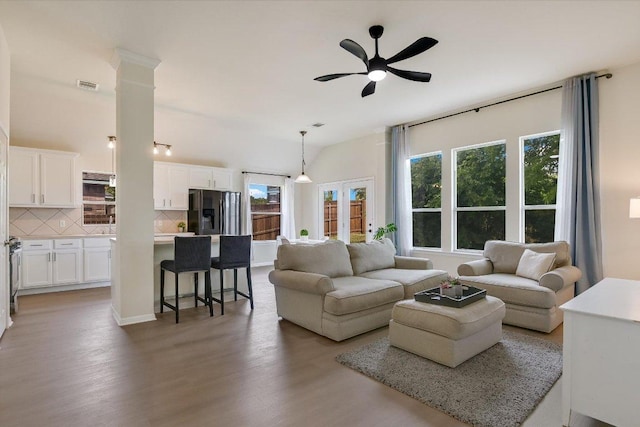 11805 Larch Valley Dr, Austin, TX 78754 - living room featuring a ceiling fan, light wood finished floors, and ornate columns