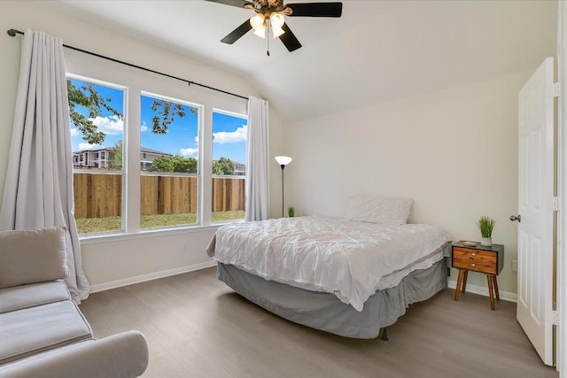 11805 Larch Valley Dr, Austin, TX 78754 - bedroom with wood finished floors, lofted ceiling, and a ceiling fan