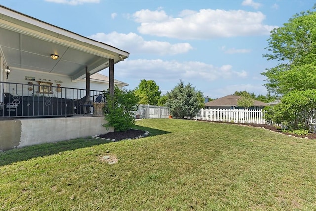 view of yard with a fenced backyard