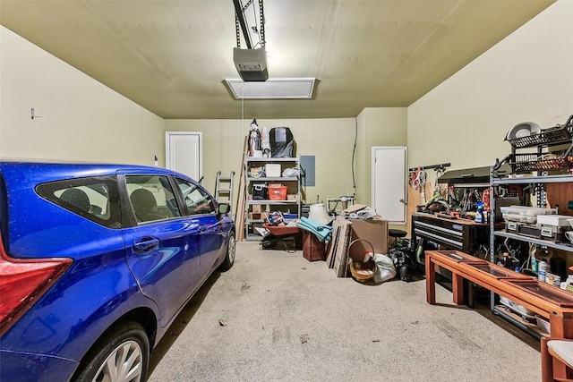 garage featuring a workshop area and a garage door opener