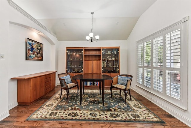 dining area featuring lofted ceiling, dark wood-type flooring, a chandelier, and baseboards