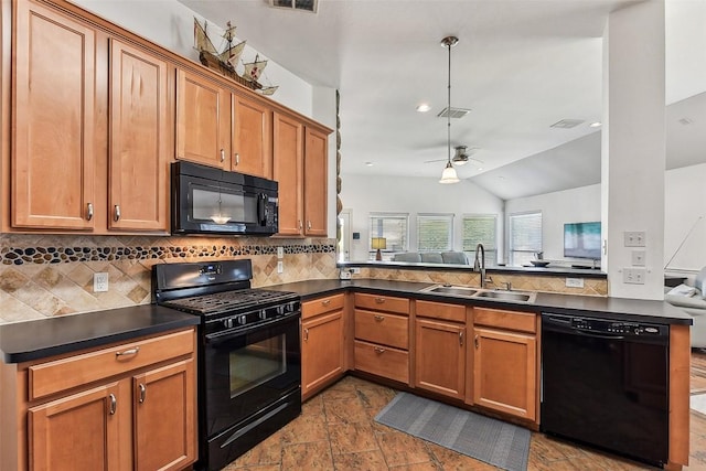 kitchen featuring tasteful backsplash, black appliances, dark countertops, a sink, and lofted ceiling