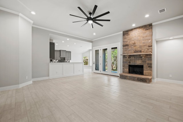 unfurnished living room featuring recessed lighting, a fireplace, a ceiling fan, visible vents, and ornamental molding