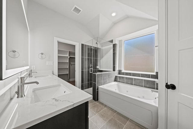 full bath featuring a sink, a shower stall, a whirlpool tub, double vanity, and visible vents
