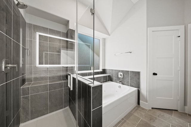 bathroom featuring a garden tub, tile patterned flooring, and a stall shower