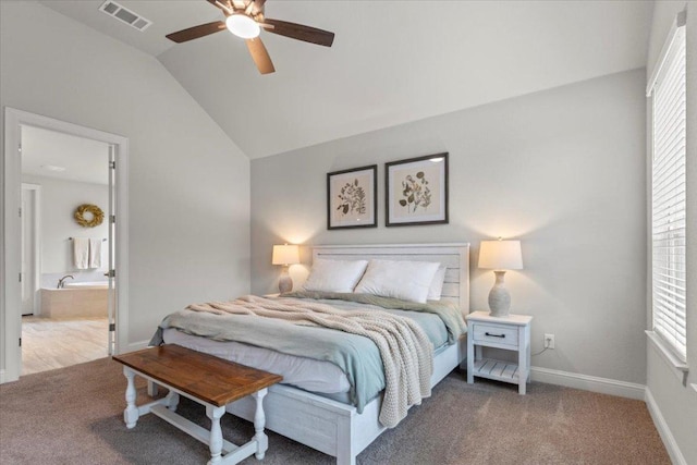 carpeted bedroom with visible vents, vaulted ceiling, multiple windows, and baseboards