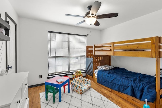 205 Kamakoa Ln, Bastrop, TX 78602 - bedroom featuring light wood finished floors and a ceiling fan
