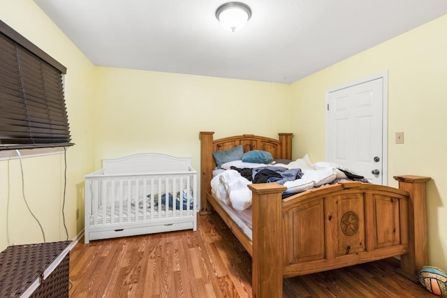 bedroom with wood finished floors