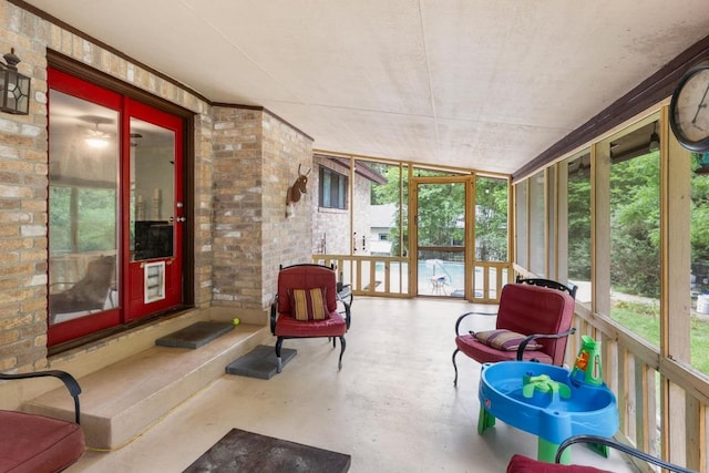 sunroom featuring french doors