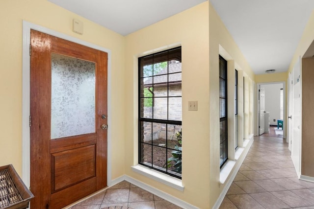 205 Kamakoa Ln, Bastrop, TX 78602 - foyer entrance with light tile patterned flooring and baseboards