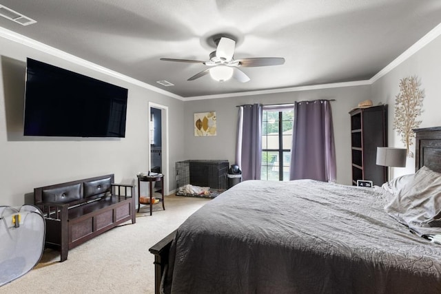 bedroom with visible vents, crown molding, and carpet floors