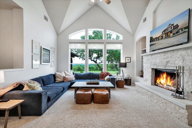 440 Currie Ranch Rd, Wimberley, TX 78676 - living area with carpet flooring, visible vents, ceiling fan, and a stone fireplace