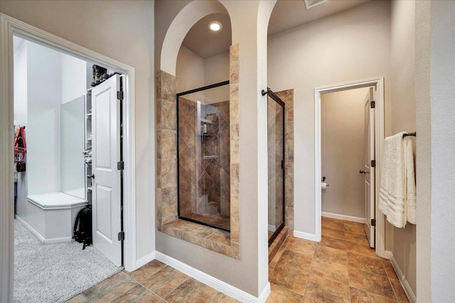 440 Currie Ranch Rd, Wimberley, TX 78676 - full bathroom featuring a shower stall and baseboards