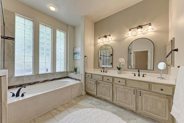 2402 Silent Brook Trl, Round Rock, TX 78665 - bathroom with double vanity and a bath