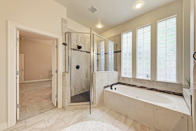 full bath featuring a stall shower, a bath, and a healthy amount of sunlight