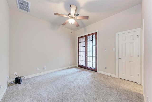 2402 Silent Brook Trl, Round Rock, TX 78665 - carpeted spare room featuring a ceiling fan and french doors