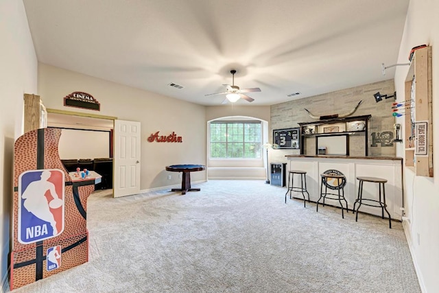 game room with visible vents, ceiling fan, carpet, and baseboards