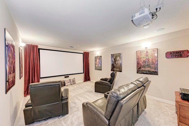 cinema room with visible vents, carpet, and baseboards