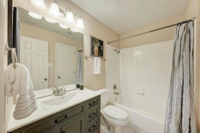 full bathroom featuring toilet, vanity, visible vents, and shower / tub combo with curtain