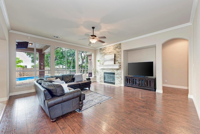 living area featuring a ceiling fan, visible vents, wood finished floors, and baseboards