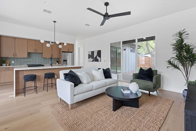 6400 Cannonleague Dr, Austin, TX 78745 - living room with light wood-style flooring and a ceiling fan