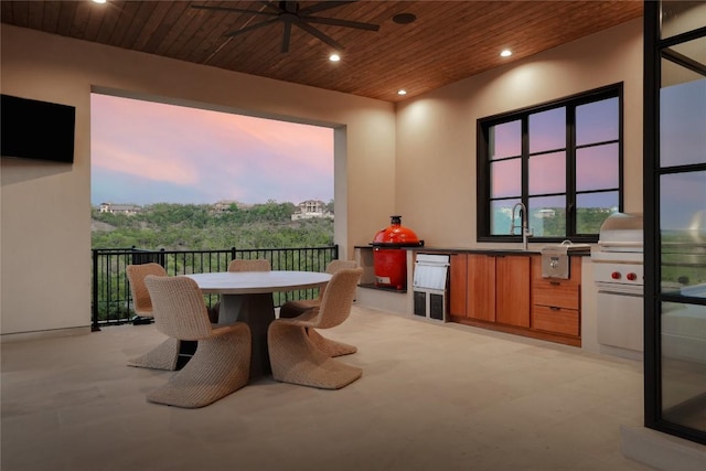 exterior space featuring wood ceiling, ceiling fan, recessed lighting, and a sink