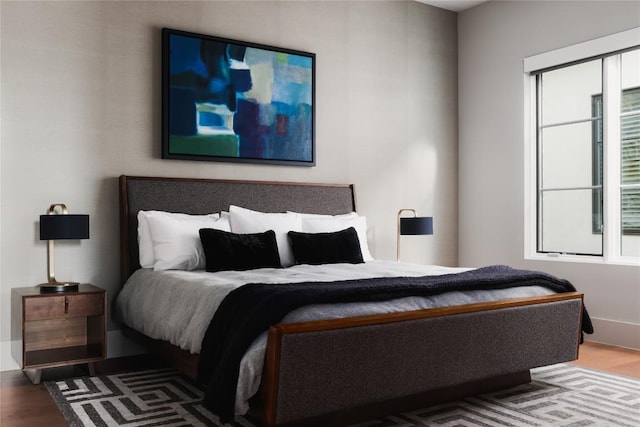 bedroom featuring wood finished floors