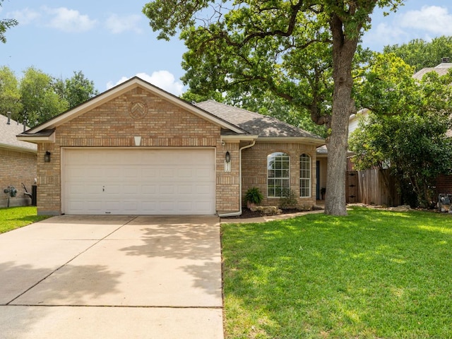 ranch-style house featuring brick siding, a garage, a front lawn, and driveway