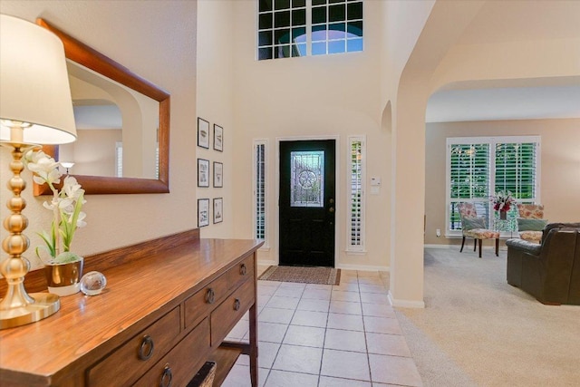 15617 Pumpkin Ridge Dr, Austin, TX 78717 - entrance foyer featuring baseboards, light carpet, and light tile patterned floors