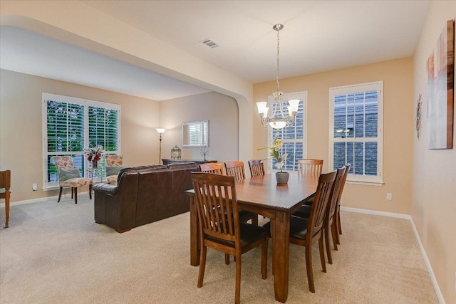 15617 Pumpkin Ridge Dr, Austin, TX 78717 - dining space featuring light colored carpet, a chandelier, and baseboards