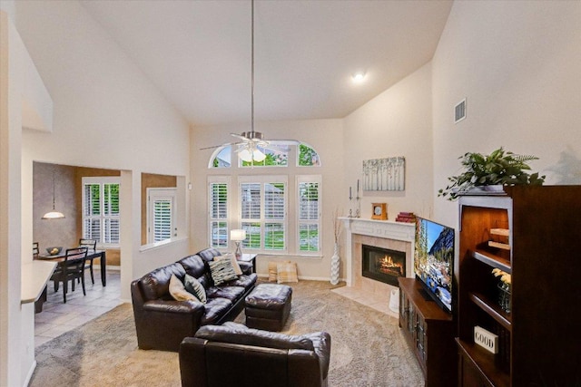 15617 Pumpkin Ridge Dr, Austin, TX 78717 - living area featuring a ceiling fan, high vaulted ceiling, tile patterned flooring, and a premium fireplace