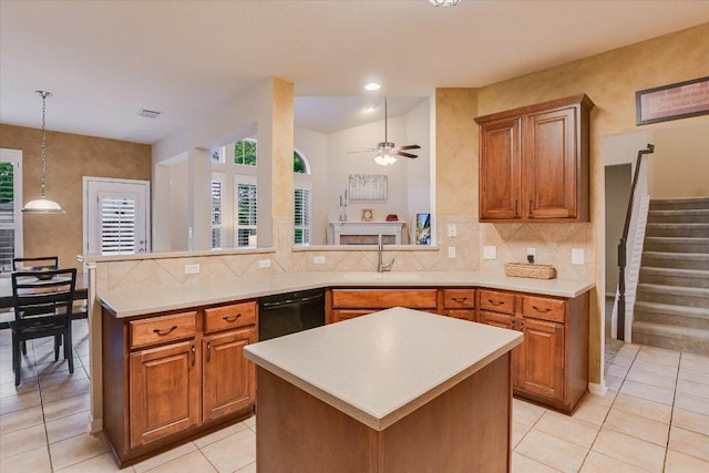 15617 Pumpkin Ridge Dr, Austin, TX 78717 - kitchen with black dishwasher, a sink, light countertops, brown cabinets, and recessed lighting