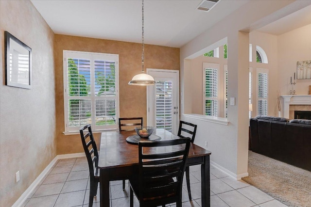 15617 Pumpkin Ridge Dr, Austin, TX 78717 - dining area with light tile patterned flooring, plenty of natural light, baseboards, and a textured wall