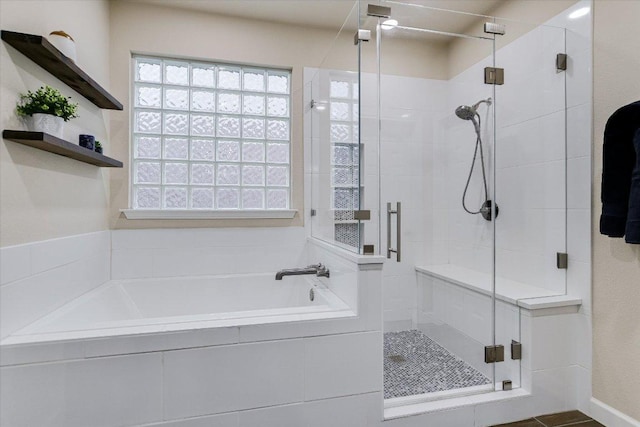 15617 Pumpkin Ridge Dr, Austin, TX 78717 - bathroom featuring a bath, a shower stall, and healthy amount of natural light