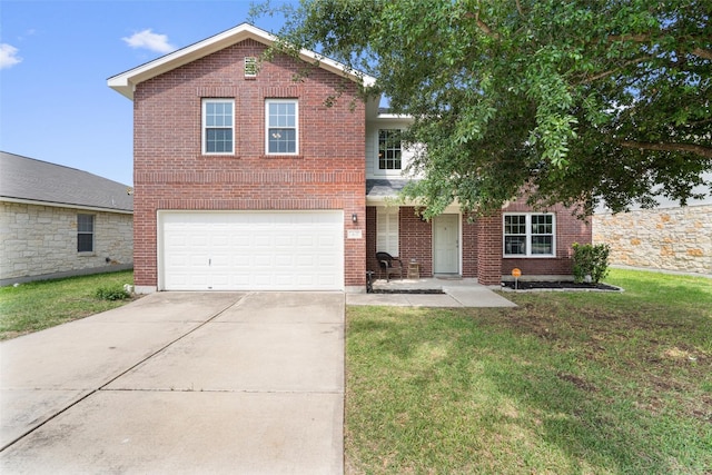 407 Blackman Trl, Hutto, TX 78634 - traditional home with concrete driveway, a garage, a front yard, and brick siding