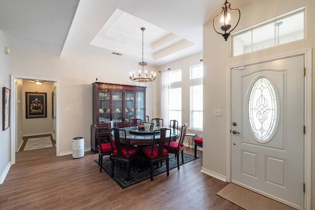 4906 Thunderbird Dr, Lago Vista, TX 78645 - entryway with a chandelier, wood finished floors, and a raised ceiling