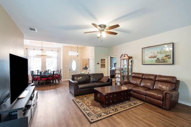 4906 Thunderbird Dr, Lago Vista, TX 78645 - living area with wood finished floors, ceiling fan, and a chandelier