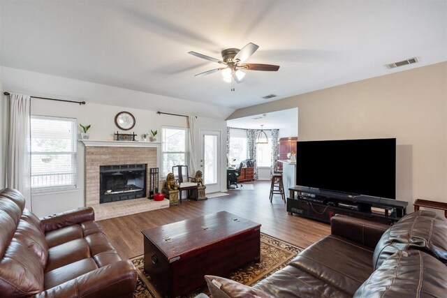 4906 Thunderbird Dr, Lago Vista, TX 78645 - living area with ceiling fan, wood finished floors, and a fireplace