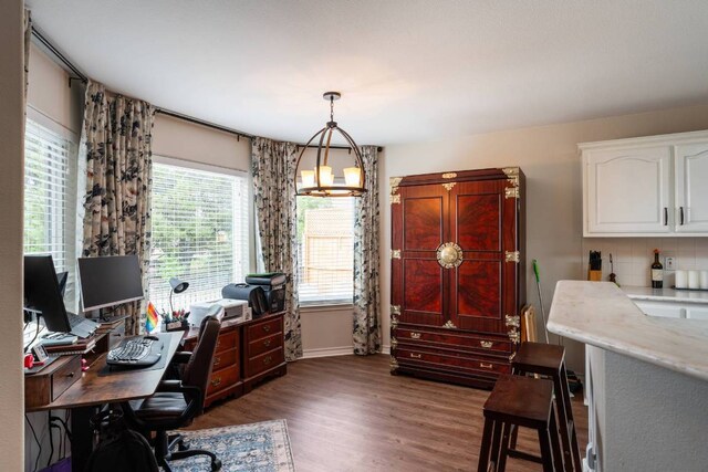 4906 Thunderbird Dr, Lago Vista, TX 78645 - home office featuring dark wood finished floors and baseboards